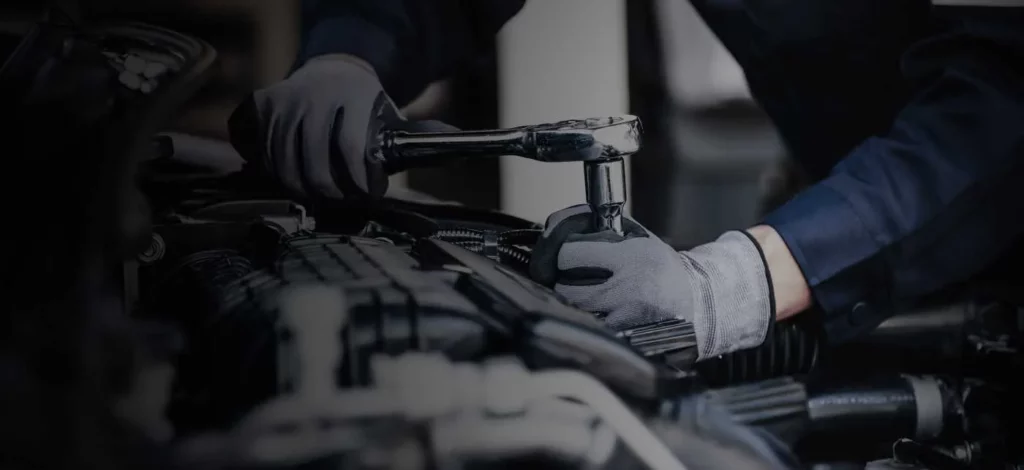 An engineer tightening with a wrench.